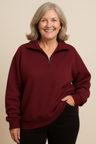 Image of the Elara quarter-zip knit in black, offering a sophisticated and timeless option for the stylish pullover.