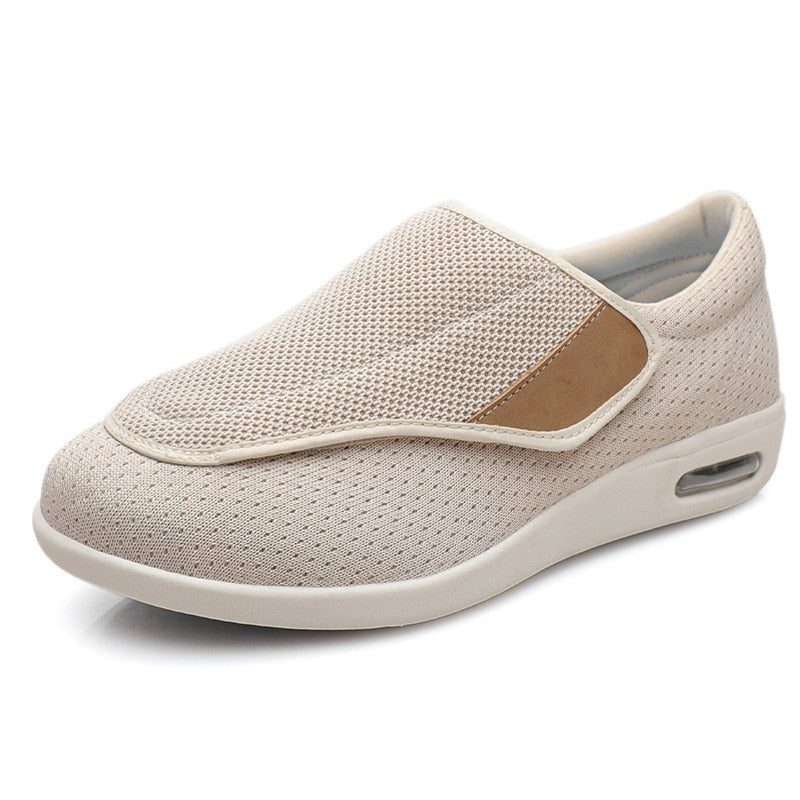 A pair of beige Elara women's comfort shoes positioned on a clean surface, emphasizing their soft appearance.
