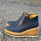 Product lineup of all available colors of Elara casual wedge ankle boots on a neutral background.