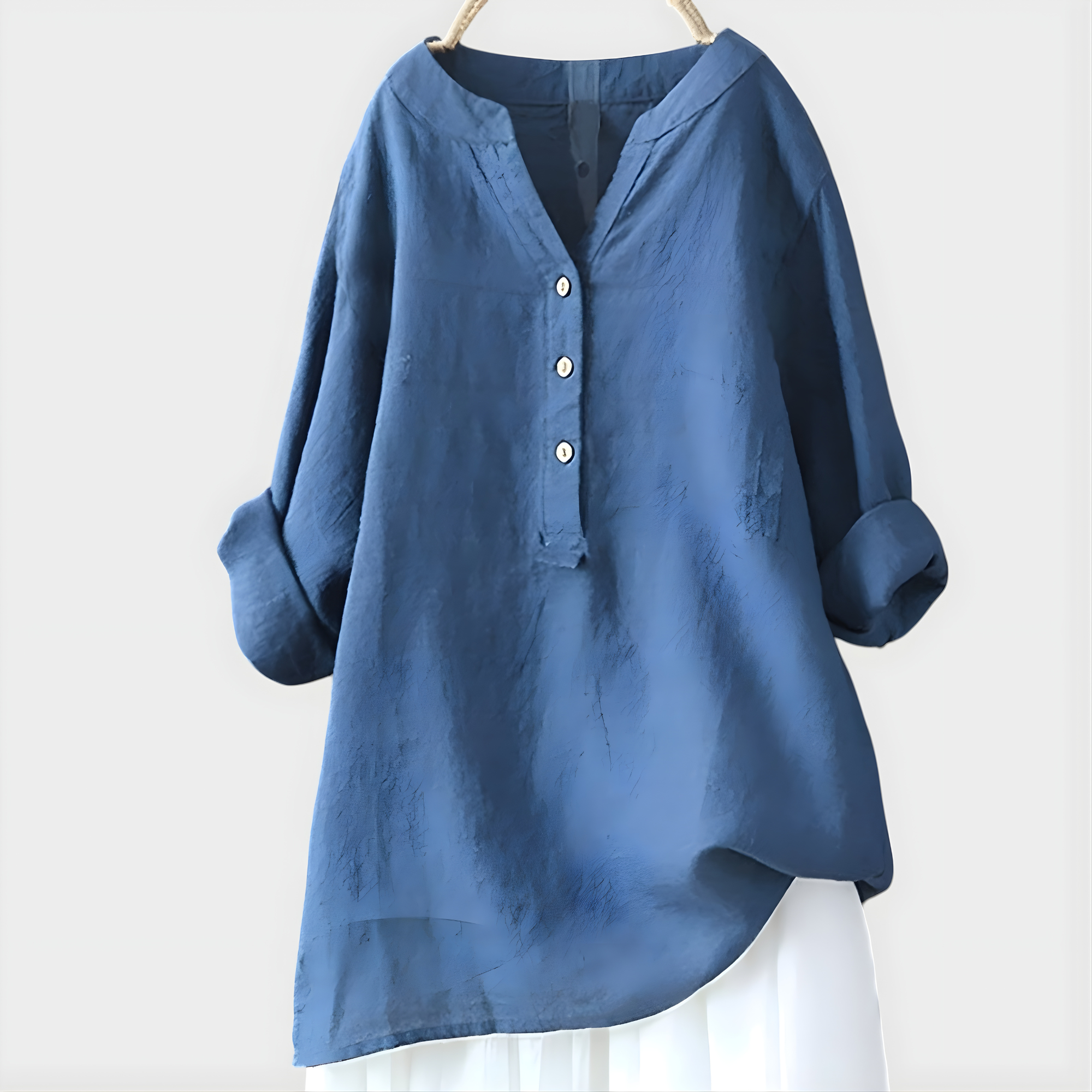 Woman walking outdoors, wearing the Elara elegant cotton-linen blouse in navy blue, comfortable and chic.