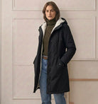 Three-quarter view of the black Elara parka, demonstrating its flattering tapered waist design.
