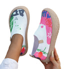 The Ella artistic slip-on shoes displayed on a clean surface, emphasizing their cheerful and colorful aesthetic.