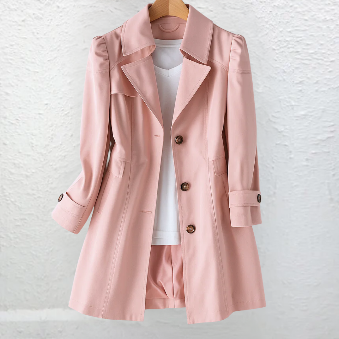 Side profile of a woman showcasing the draped fit of the beige Estelle elegant summer trench coat.