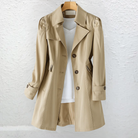 Back view of the Estelle elegant summer trench coat, highlighting the clean lines and belt detail.
