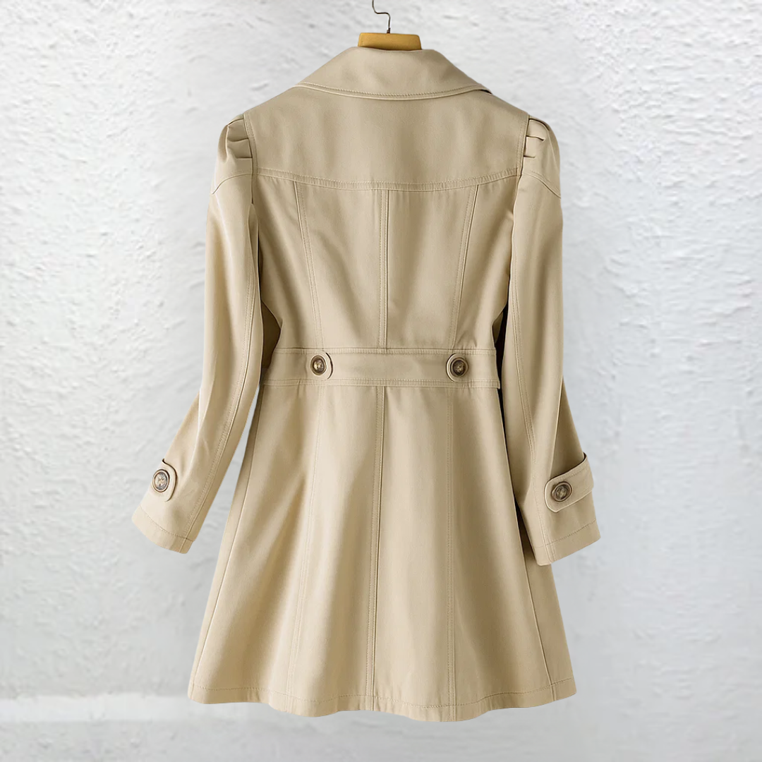 Detail shot of the button closure and collar on the black Estelle elegant summer trench coat.