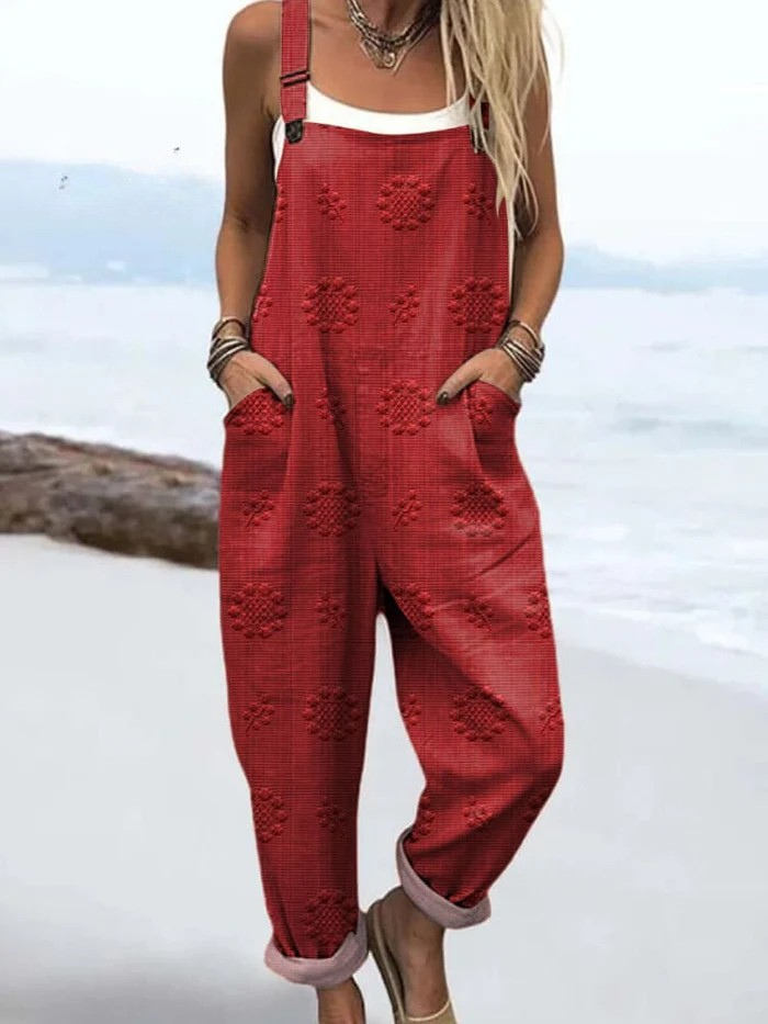 Side profile of the Evanthe floral pattern jumpsuit, showing the adjustable straps and deep front pockets.