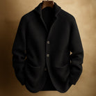 Man standing outdoors wearing the brown Florian wool cardigan, styled for a casual, elegant look.