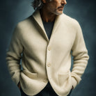 Close-up of the shawl collar on the men's wool cardigan, emphasizing its refined curve and finish.