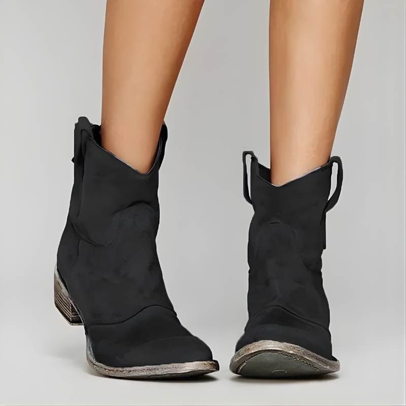 Side profile of a black Hadley vintage cowboy ankle boot, highlighting the comfortable heel and textured leather finish.
