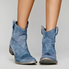 Close-up view of the detailed stitching and premium leather on the shaft of a grey Hadley vintage cowboy ankle boot.