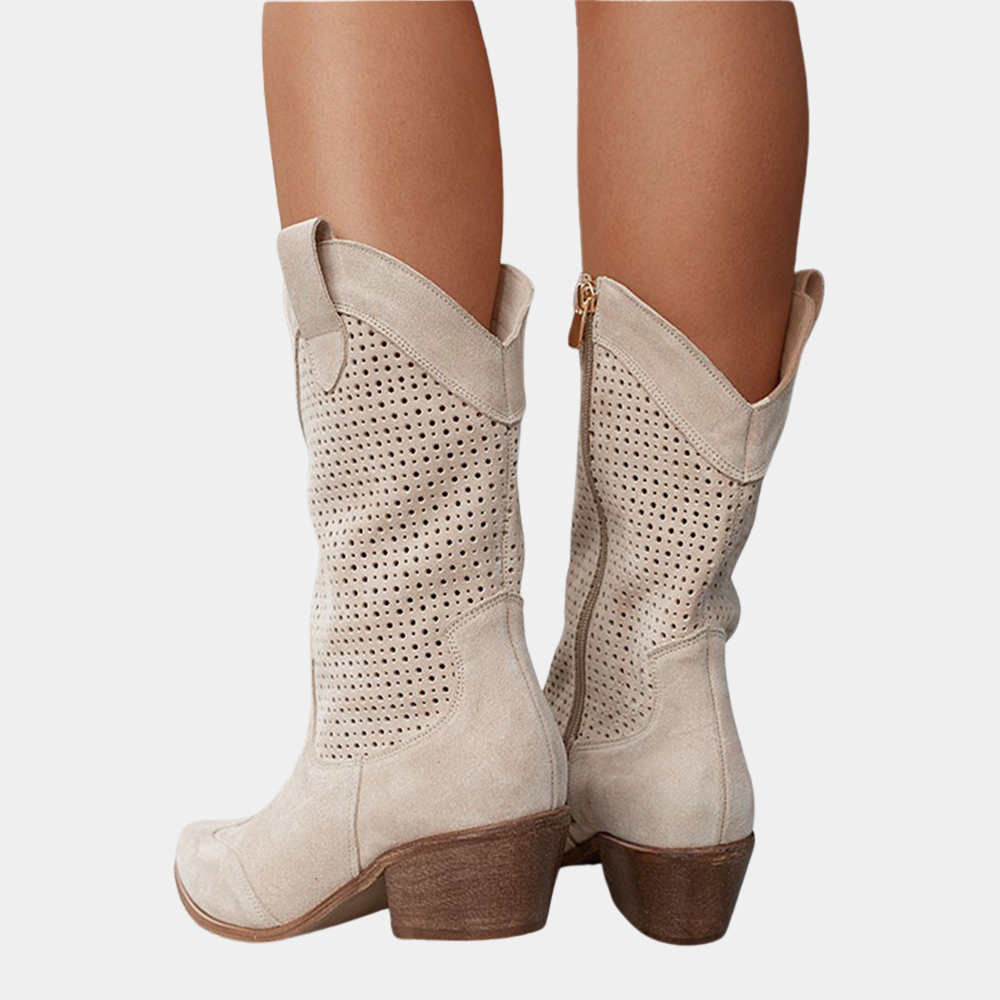 A woman confidently walking outdoors wearing the Hadley orthopedic cowboy boots, illustrating their stability and comfort.
