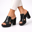 A pair of elegant comfort sandals in a rich brown color, showcased from a top-down perspective on a clean surface.
