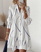 Front view of the Hadley wavy collar A-line dress in white, showcasing the unique lapel and full length.