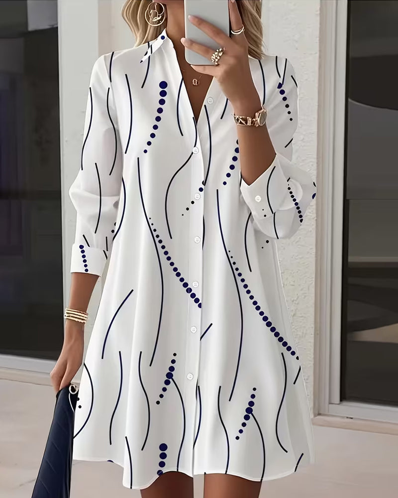 Close-up detail of the wavy collar and button placket on the white Hadley dress, highlighting the fabric texture.