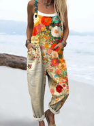 Front view of the Kaelen Floral Breeze Jumpsuit, showcasing its relaxed fit and vibrant orange, white, pink, and turquoise floral pattern.