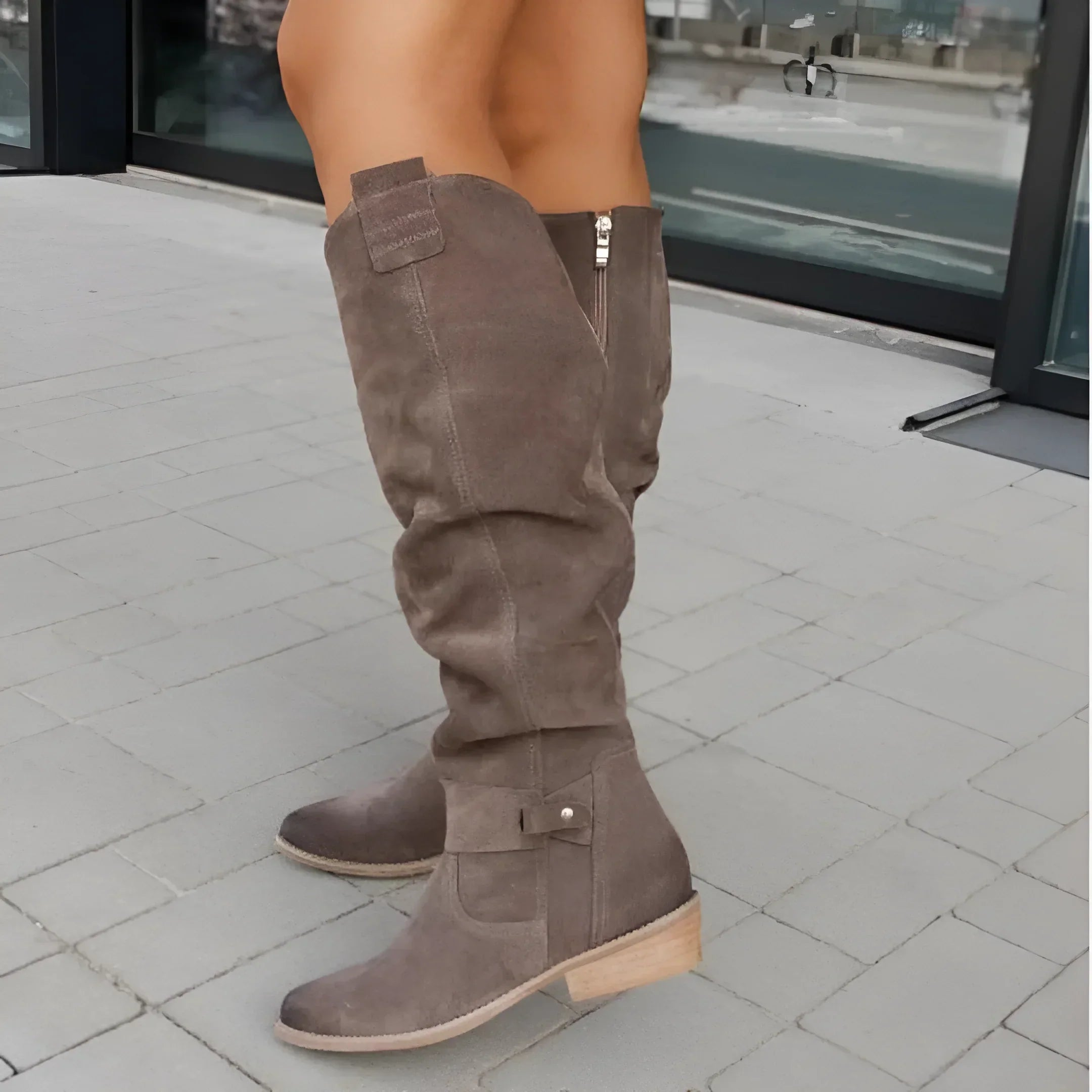 Side profile view of the black Kalina knee-high suede boots, emphasizing the comfortable 2.5-inch block heel and sleek silhouette.