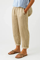 Front view of Kallista linen-cotton blend trousers in a light beige color, showcasing the relaxed fit.
