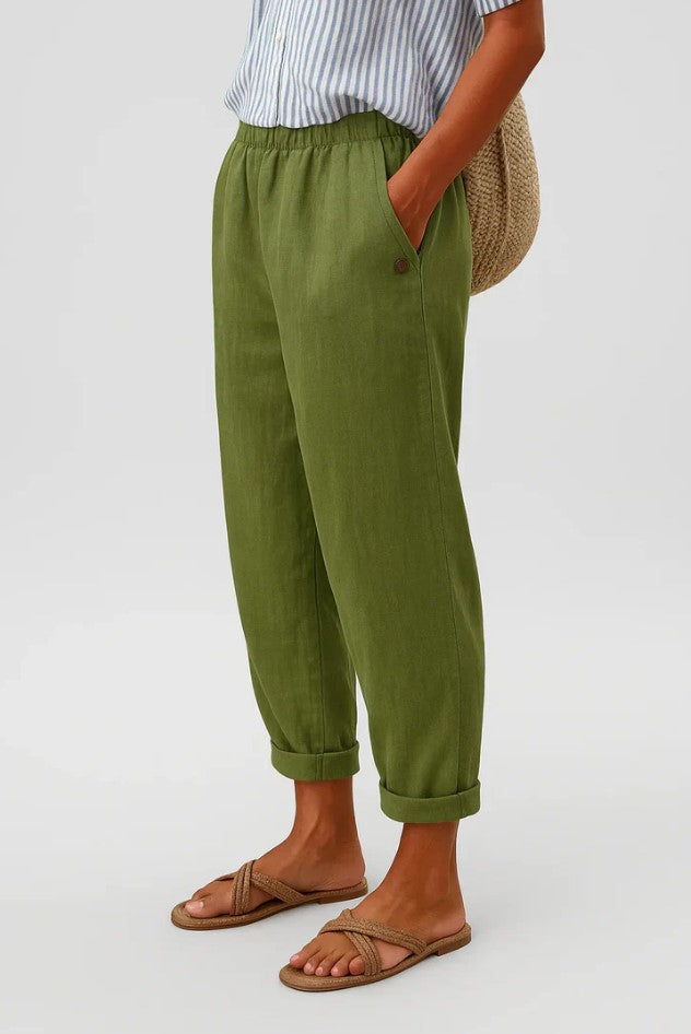 Side profile of the Kallista trousers in an olive green, highlighting the comfortable elastic waistband.
