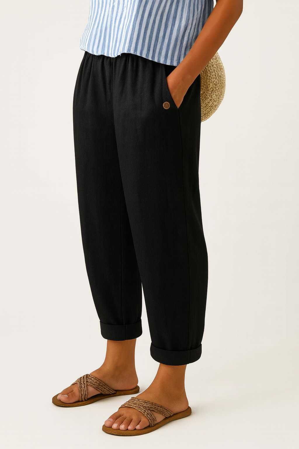 Lifestyle image featuring Kallista linen-cotton blend trousers in classic black, paired with a simple top.