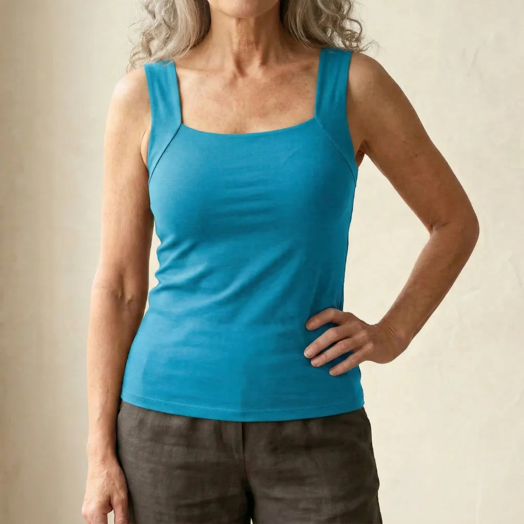 Close-up of the breathable fabric on the turquoise Keisha comfort bra tanktop.