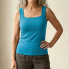 Close-up of the breathable fabric on the turquoise Keisha comfort bra tanktop.