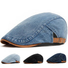 Front view of a dark blue premium denim flat cap, showcasing its classic shape and textured fabric.