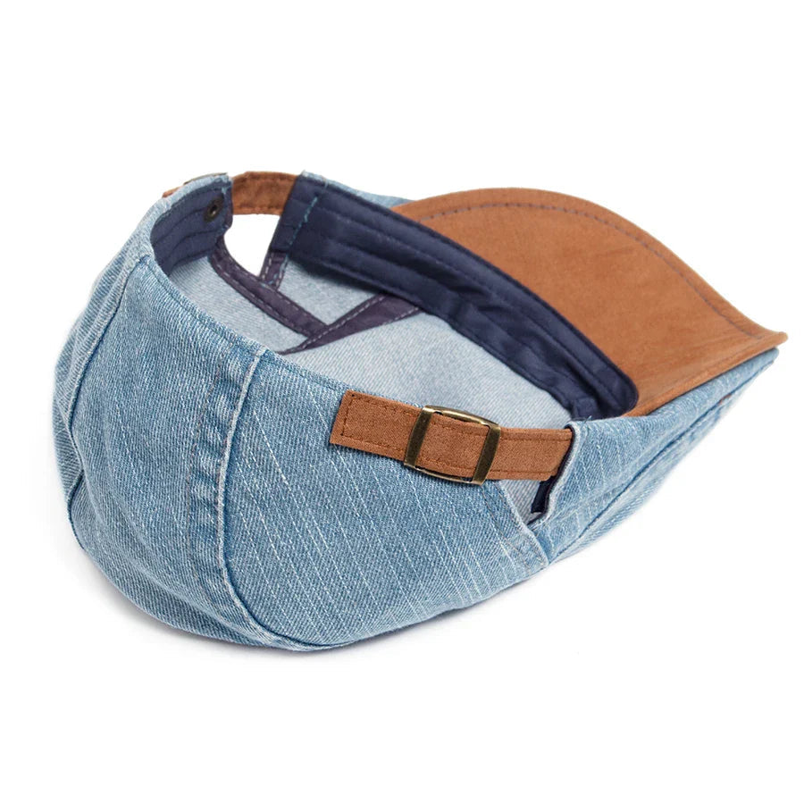 Overhead view of the premium denim flat cap, showing the top paneling and overall symmetrical design.