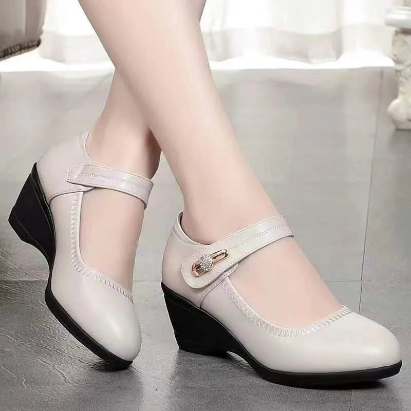 A woman wearing the Kiera orthopedic comfort shoes while standing, demonstrating their stylish appearance in a professional setting.