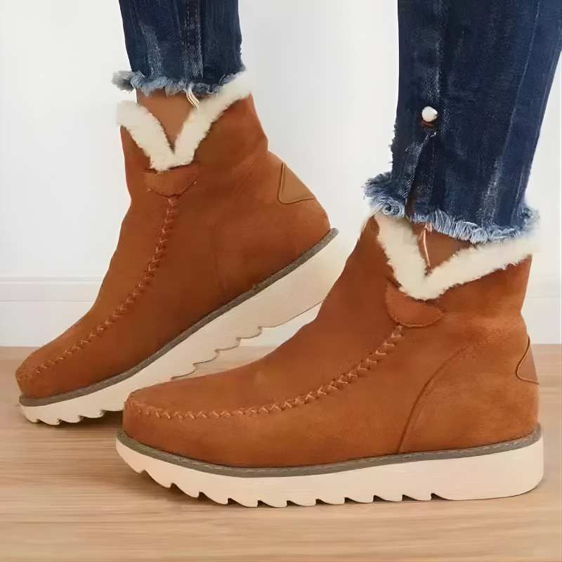 Pair of black Kira orthopedic ankle boots, front-facing view on a minimalist background.