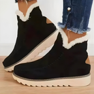 Close-up of the side profile of a brown Kira orthopedic ankle boot, highlighting the texture and zipper.