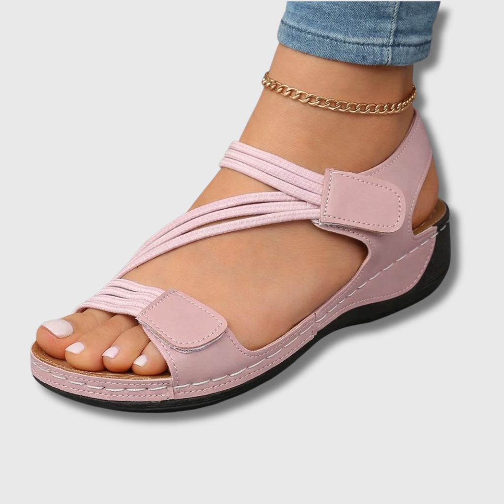 Close-up side view of a black Liana orthopedic comfort sandal, highlighting the ergonomic arch support and textured non-slip sole for secure walking.