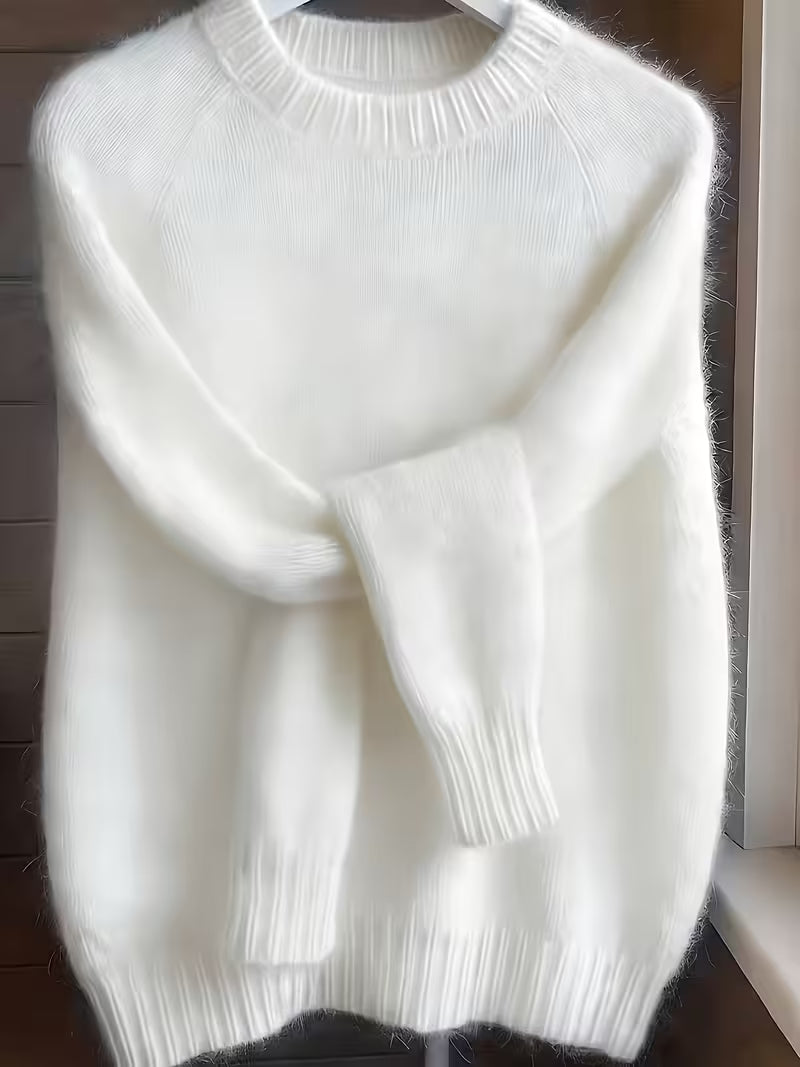 Back view of the white Lila cashmere-blend sweater, illustrating its comfortable and relaxed silhouette.