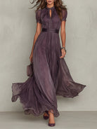 Front view of the Lyra purple chiffon lace maxi dress, showcasing the keyhole neckline and flowing skirt.