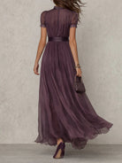 Close-up detail of the keyhole neckline and the intricate lace border on the Lyra purple dress.