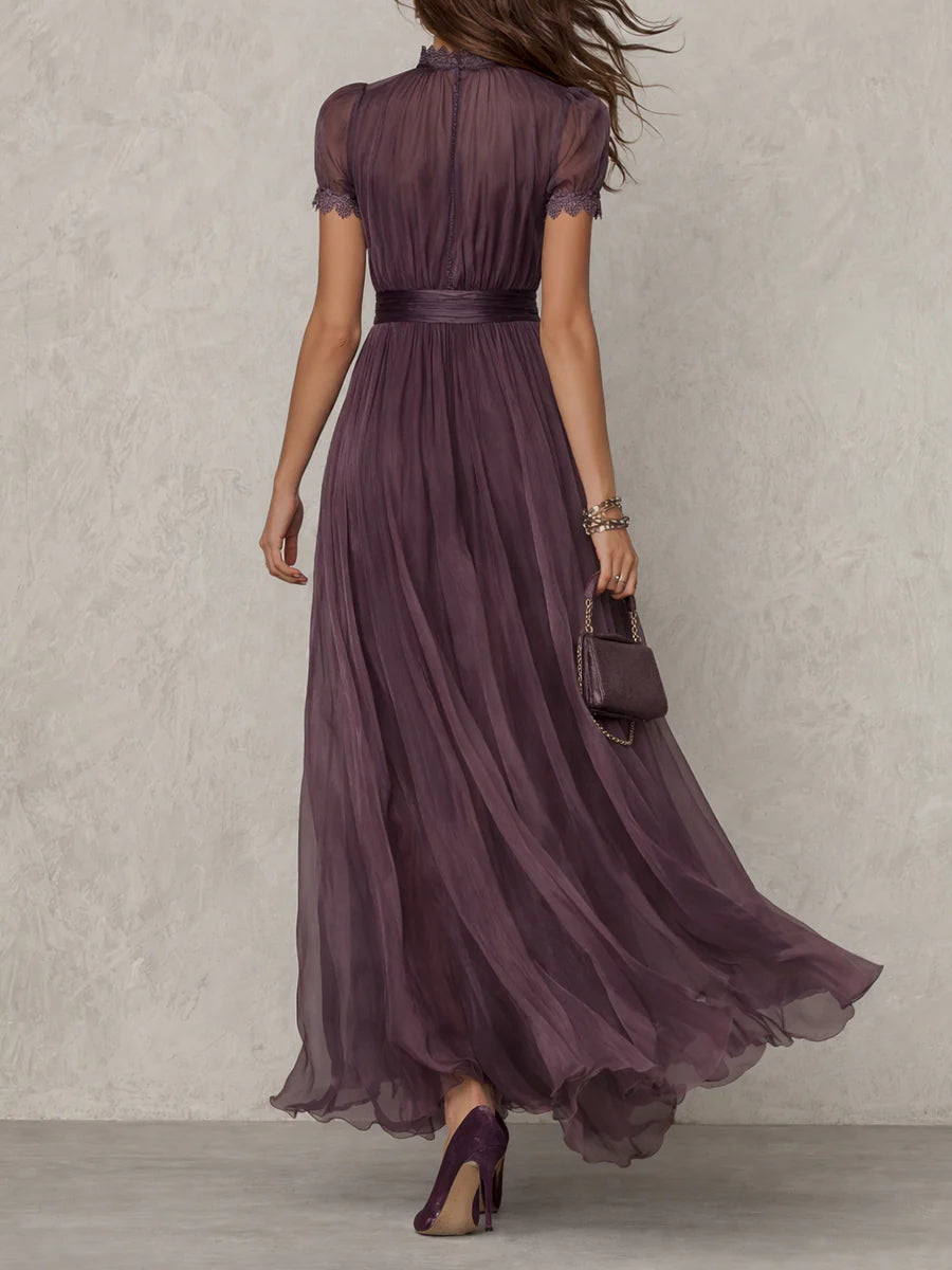 Close-up detail of the keyhole neckline and the intricate lace border on the Lyra purple dress.