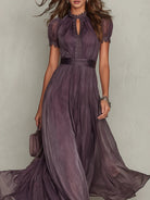 Back view of the purple chiffon lace maxi dress, emphasizing the graceful drape of the fabric and hidden zipper.