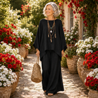 A woman relaxing outdoors in the navy two-piece set, emphasizing the comfort and breathability of the garment.