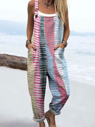 Front view of the Lysandra striped relaxed jumpsuit, showcasing its muted pastel colors and loose-fitting design on a female model.