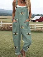 Front view of the Marlena sage green bee print jumpsuit, styled casually for a relaxed outdoor setting.