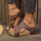 Close-up view of the metallic studs on the strap of the Marlowe studded wedge sandals, emphasizing the quality and edgy design.