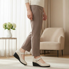 Side profile of a black Paloma comfort shoe, showcasing the stable 1.5-inch heel and ergonomic design.