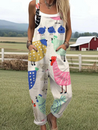 Front view of a woman wearing the whimsical patterned jumpsuit, showcasing its relaxed fit and vibrant design in a natural light setting.