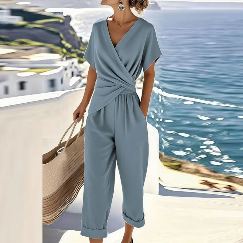 Side profile of the refined two-piece outfit in blue, highlighting the flowing fabric and comfortable fit for women.