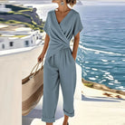 Side profile of the refined two-piece outfit in blue, highlighting the flowing fabric and comfortable fit for women.