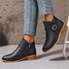 Detailed shot of the side zipper closure on the brown Zara comfort ankle boot, emphasizing ease of wear.