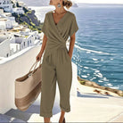 Close-up detail of the fabric texture and stitching on the khaki refined two-piece outfit, emphasizing quality.