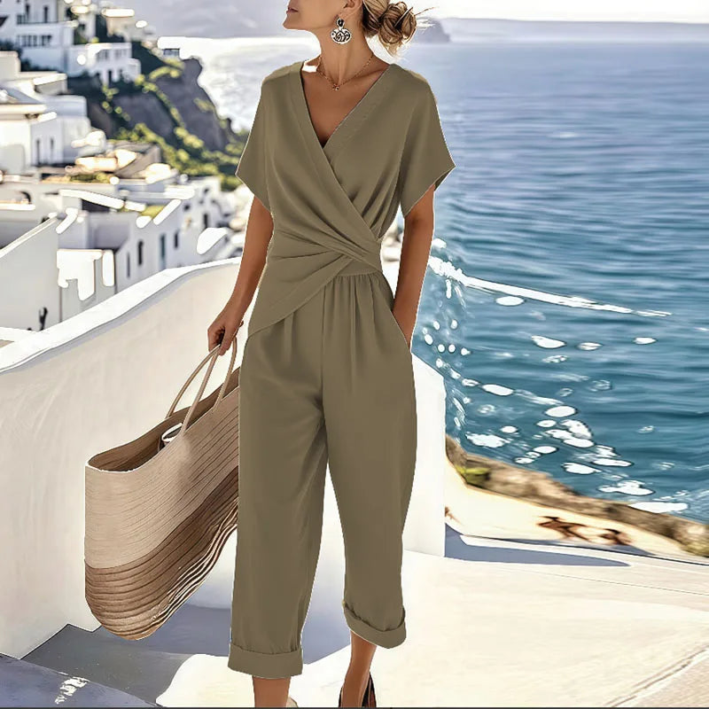 Close-up detail of the fabric texture and stitching on the khaki refined two-piece outfit, emphasizing quality.
