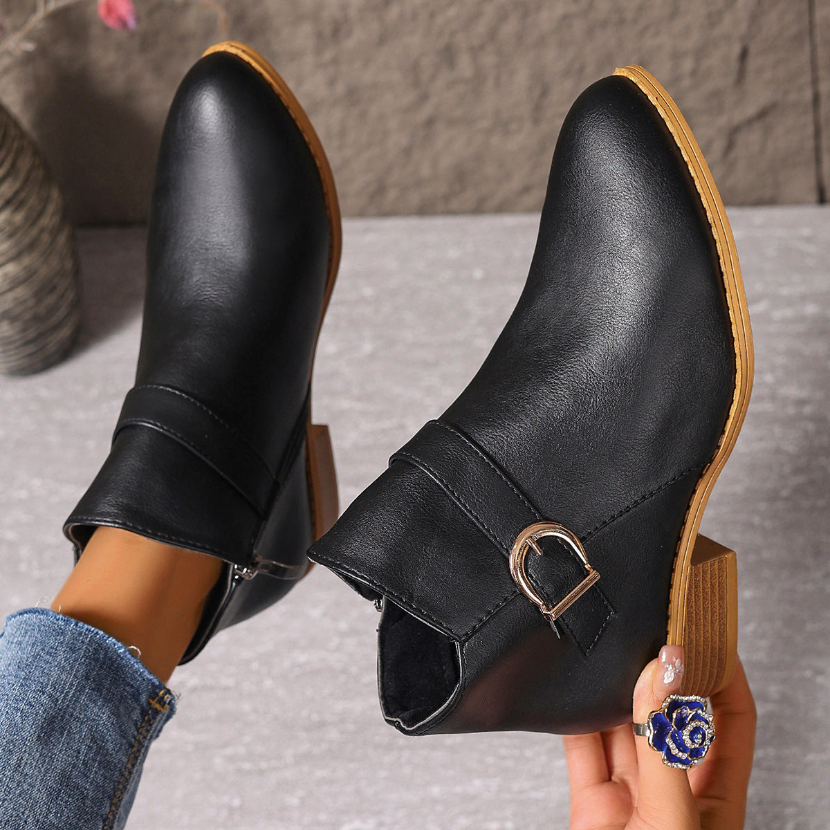 Lifestyle image of a woman walking outdoors in brown Zara comfort ankle boots, demonstrating natural movement.
