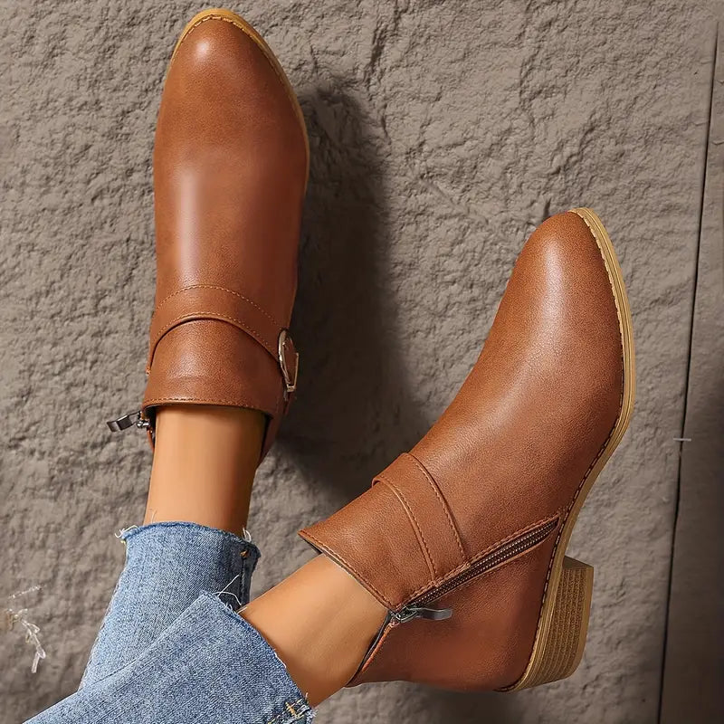 Three-quarter view of the brown Zara comfort ankle boot on a white background, highlighting its versatile style.
