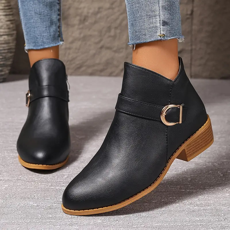 Texture detail of the synthetic leather material used in the Zara comfort ankle boot, showing its quality.